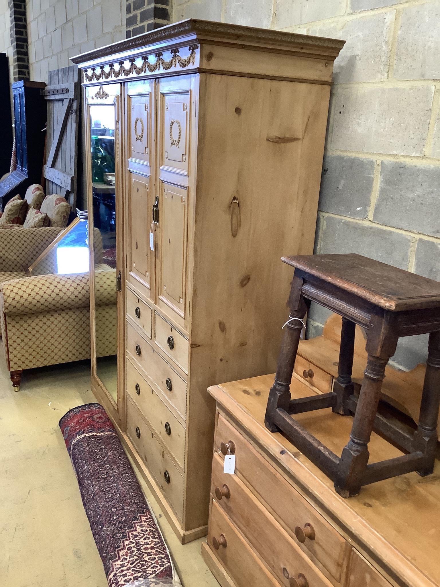 An Edwardian pine compactum wardrobe retailed by Maple & Co., length 113cm, depth 60cm, height 196cm